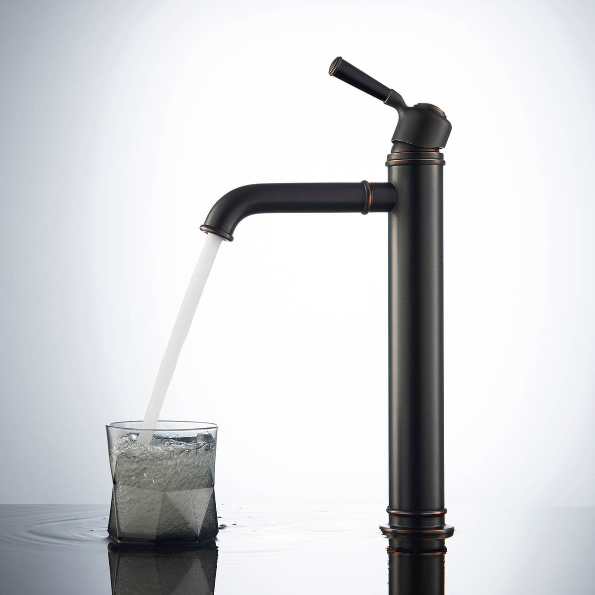 Aquavit Victoria oil-rubbed bronze vessel faucet filling a glass