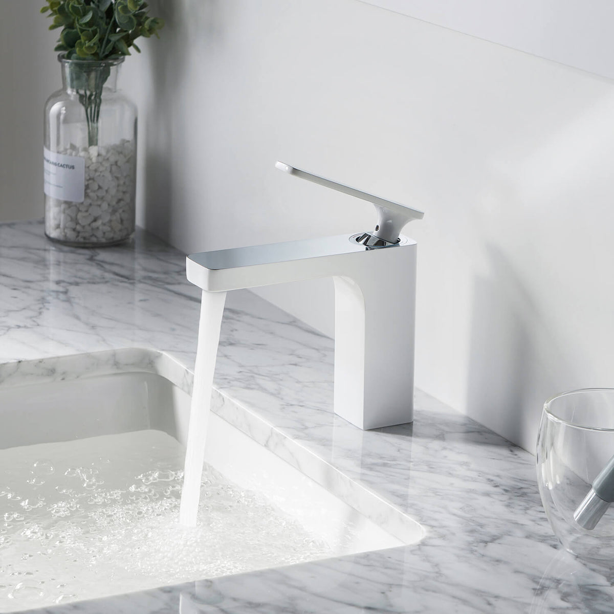 Aquavit Apple chrome white basin faucet installed on a marble bathroom sink