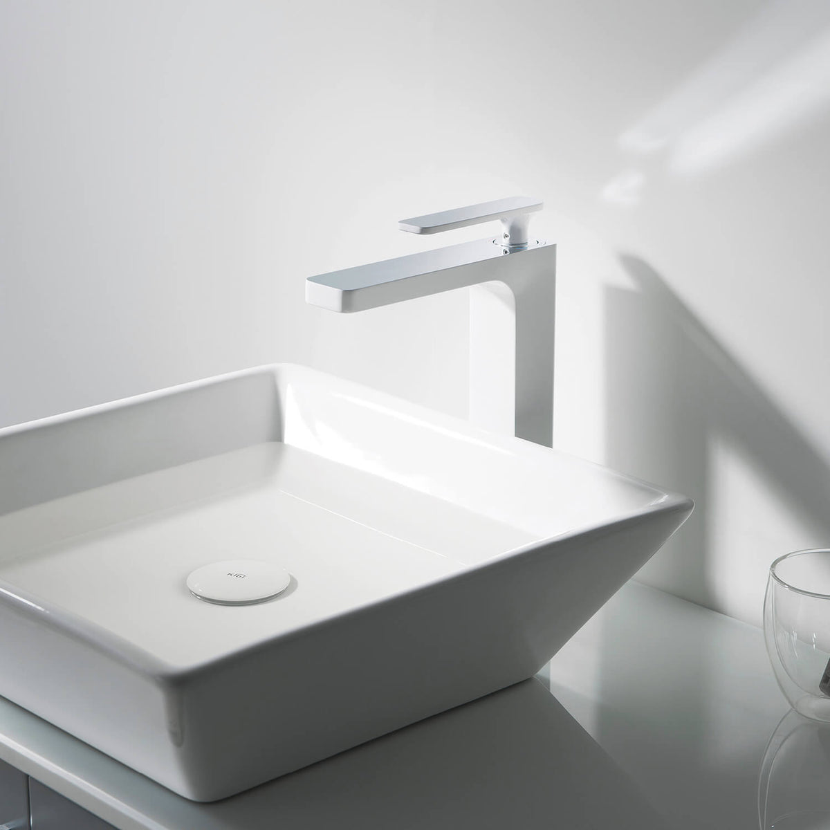 Aquavit Apple chrome White vessel sink faucet in a bright modern bathroom