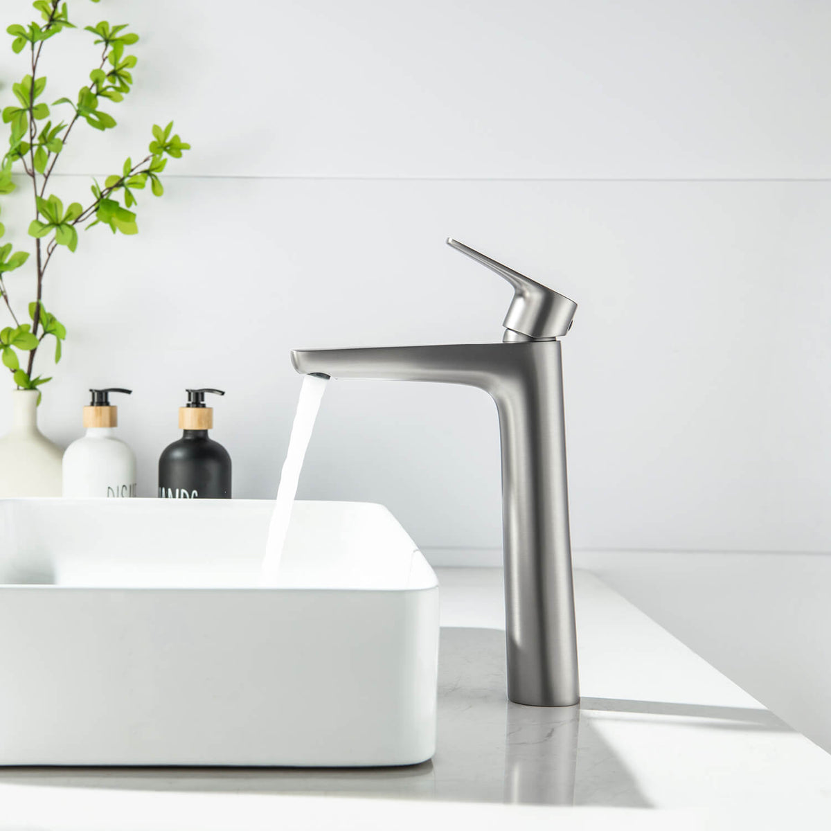 Aquavit Harmony brushed nickel vessel sink faucet beside a white vessel sink