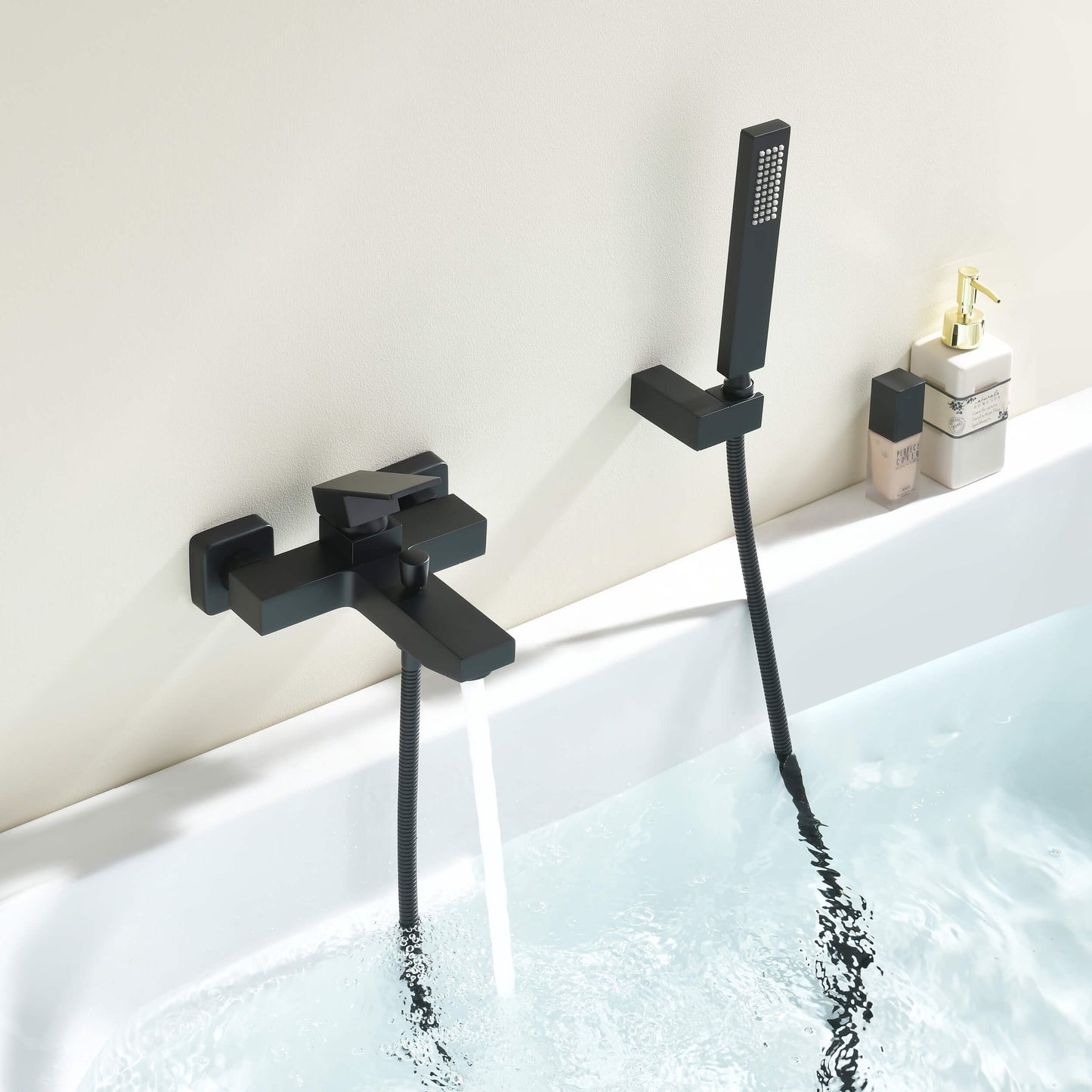 Matte black Cube bath shower mixer set installed above a bathtub AT082202