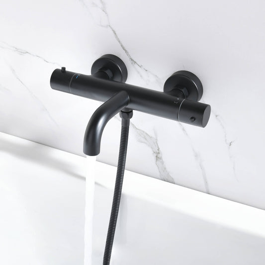 Aquavit Circular matte black thermostatic bath mixer filling a bathtub