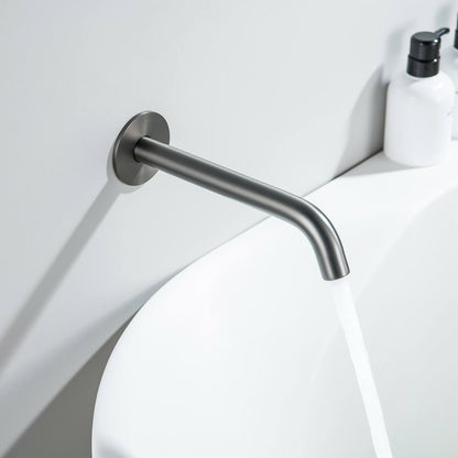 Aquavit Circular brushed gunmetal wall-mounted bath spout installed above a modern bathtub