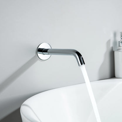 Aquavit Circular chrome wall-mounted bath spout installed above a modern bathtub