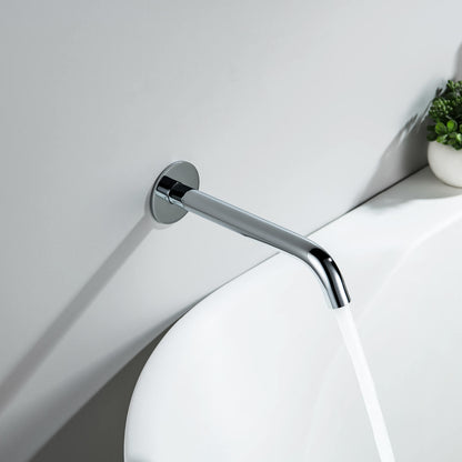 Aquavit Circular chrome bath spout delivering water into a contemporary bathtub