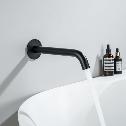 Aquavit Circular matte black wall-mounted bath spout installed above a bathtub