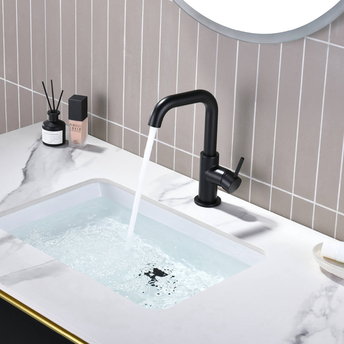 Aquavit Circular matte black basin faucet AT090711 in modern bathroom setting