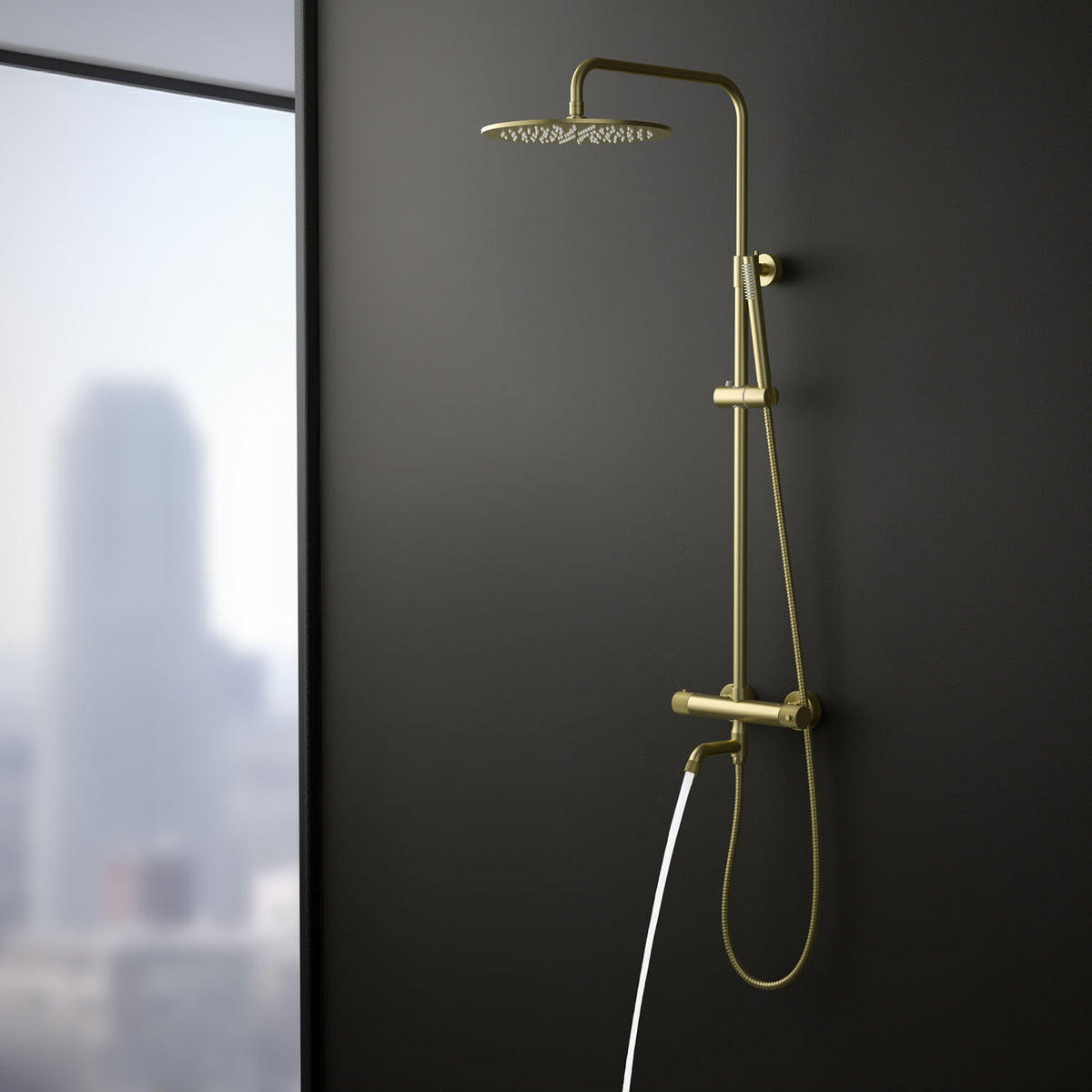 Aquavit AT107301 brushed gold shower column with swivel brass bath spout in use