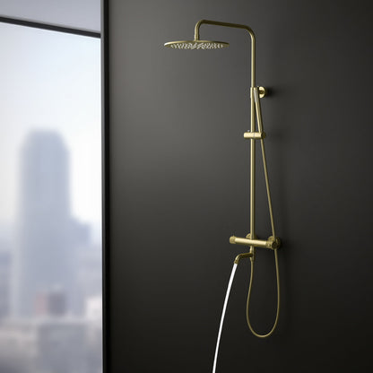Aquavit AT107301 brushed gold shower column with swivel brass bath spout in use