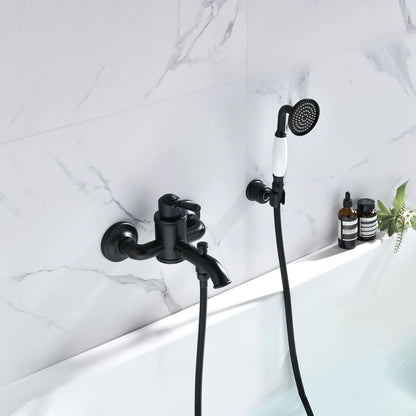 Aquavit Victoria matte black wall-mounted bath shower mixer set installed above a bathtub AT152201