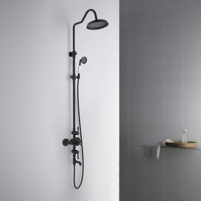 Aquavit Victoria matte black shower column installed against light bathroom wall