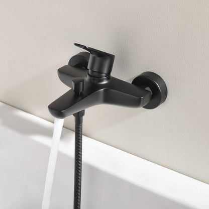 Aquavit Harmony matte black bath shower mixer installed above bathtub AT222200