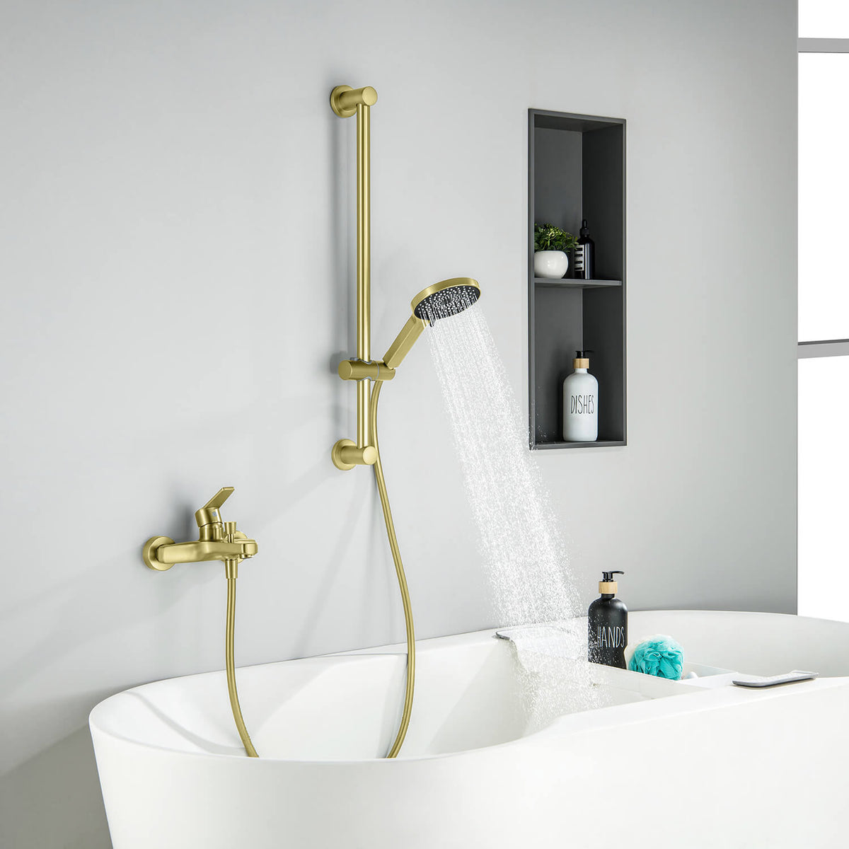 Aquavit Sense brushed gold bath shower mixer set installed beside a bathtub