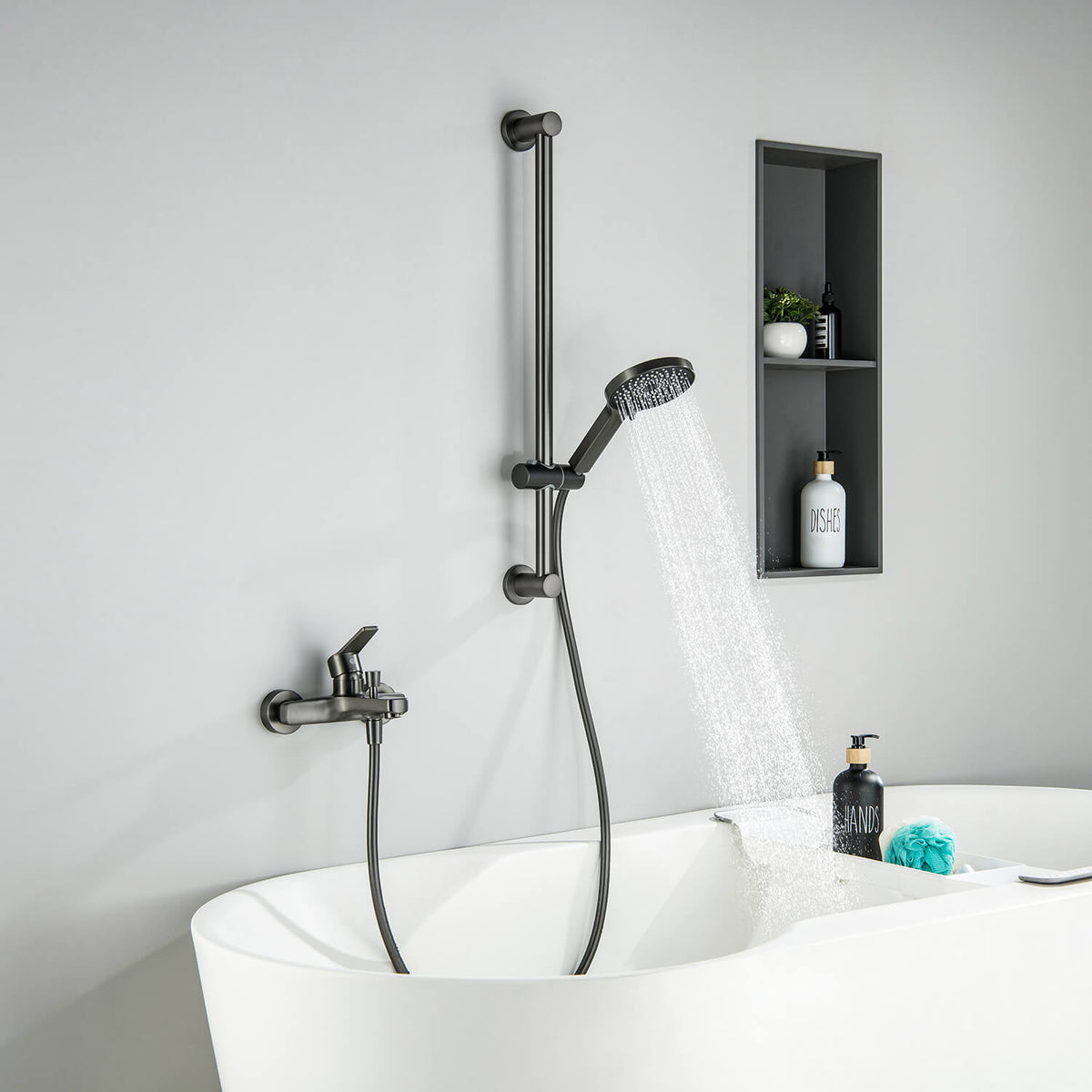 Aquavit Sense brushed gunmetal bath shower mixer installed beside a bathtub