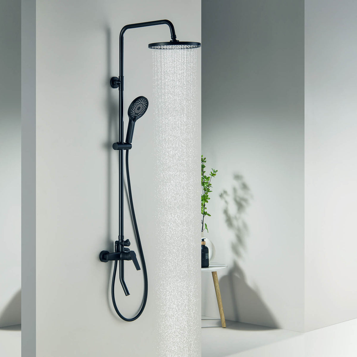 Aquavit Sense matte black shower column operating in a modern bathroom