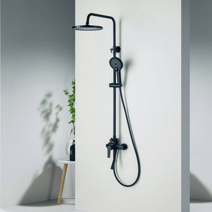 Aquavit Sense matte black three-outlet shower column installed beside a wall niche